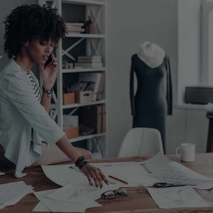 Service business owner reviewing payment processing statement fees